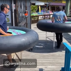 مطعم يفرض على زواره ارتداء إطارات عملاقة لحمايتهم من كورونا